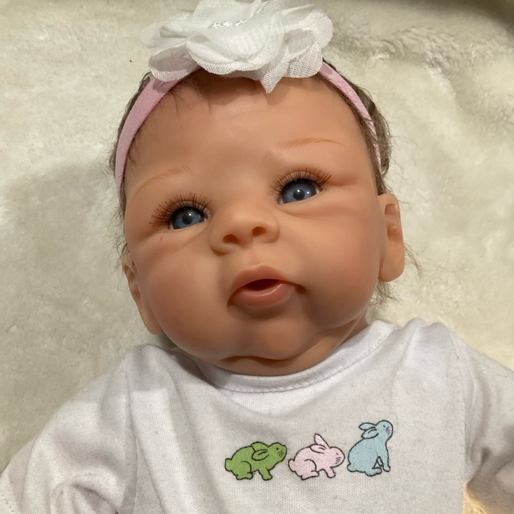 Soft-Look Baby Doll with Pink Headband and Blue Eyes cloth body